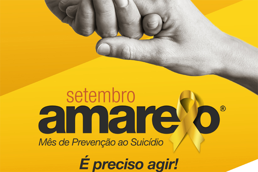 Imagem com fundo amarelo mostra a mão de uma pessoa segurando e levantando, também pela mão, outra pessoa. Abaixo das duas mãos, há os dizeres: "setembro amarelo, mês de prevenção ao suicídio: é preciso agir!"